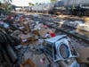 Shredded boxes and packages are seen at a section of the Union Pacific train tracks in downtown Los Angeles Friday, Jan. 14, 2022. 