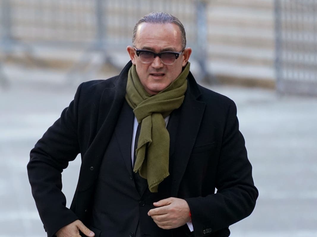 Igor Fruman arrives at Federal court in Manhattan, Friday, Jan. 21, 2022. The Florida businessman who helped Rudy Giuliani seek damaging information against Joe Biden in Ukraine faces sentencing in an unrelated campaign finance case.