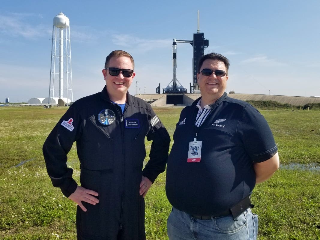 This photo provided by Kyle Hippchen shows him, right, with Chris Sembroski near launch complex 39A in Cape Canaveral. Hippchen says Sembroski is the one person “who lives and breathes” space stuff like he does.