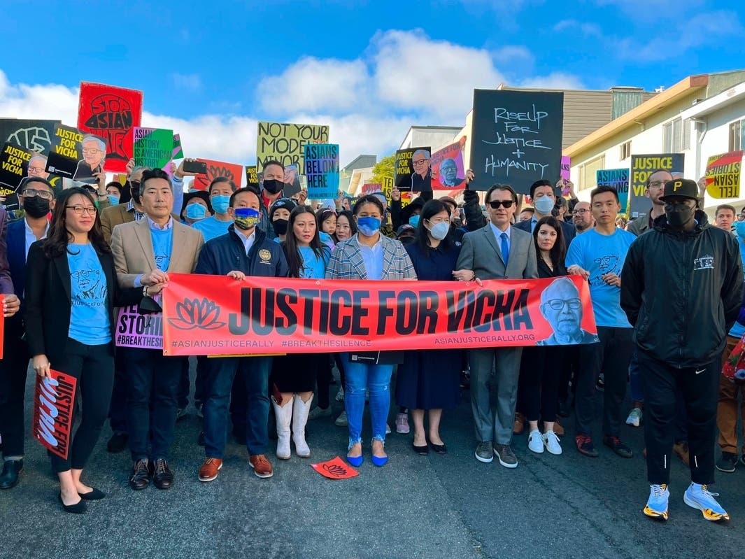 Hundreds of people hold a rally Sunday, Jan. 30, 2022, in San Francisco and five other U.S. cities to remember the death of 84-year-old Vicha Ratanapakdee.