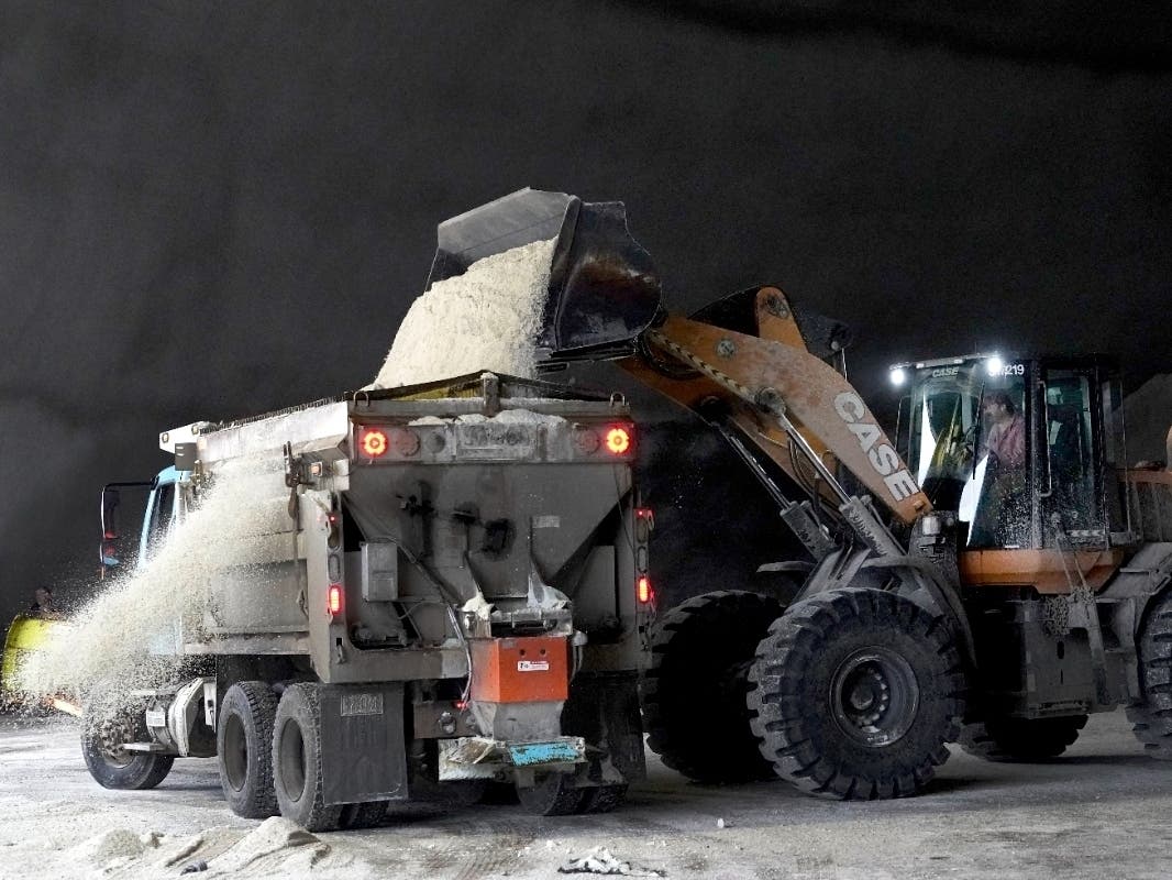 City of Chicago Department of Streets and Sanitation employees load a salt truck at a city salt dome Tuesday in anticipation of a major winter storm expected to affect a huge swath of the United States. Airlines have already canceled hundreds of flights.
