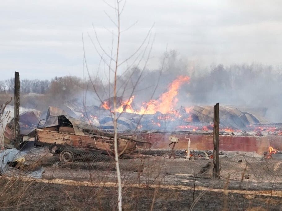 Flame and smoke rise from the debris of a privet house in the aftermath of Russian shelling outside Kyiv, Ukraine, Thursday, Feb. 24, 2022. Russia on Thursday unleashed a barrage of air and missile strikes on Ukrainian facilities across the country.
