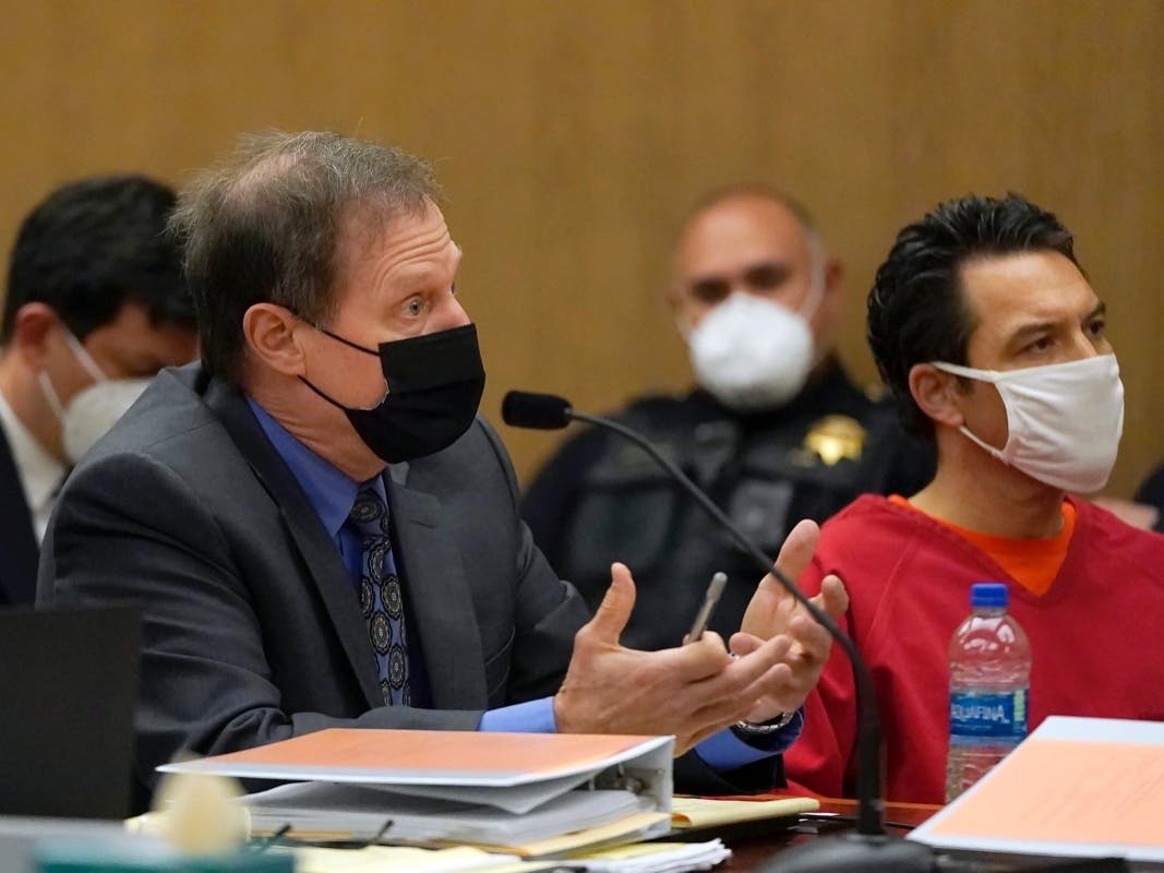 Scott Peterson, right, listens as attorney Cliff Gardner speaks during a hearing at the San Mateo County Superior Court in Redwood City, Calif., Friday.