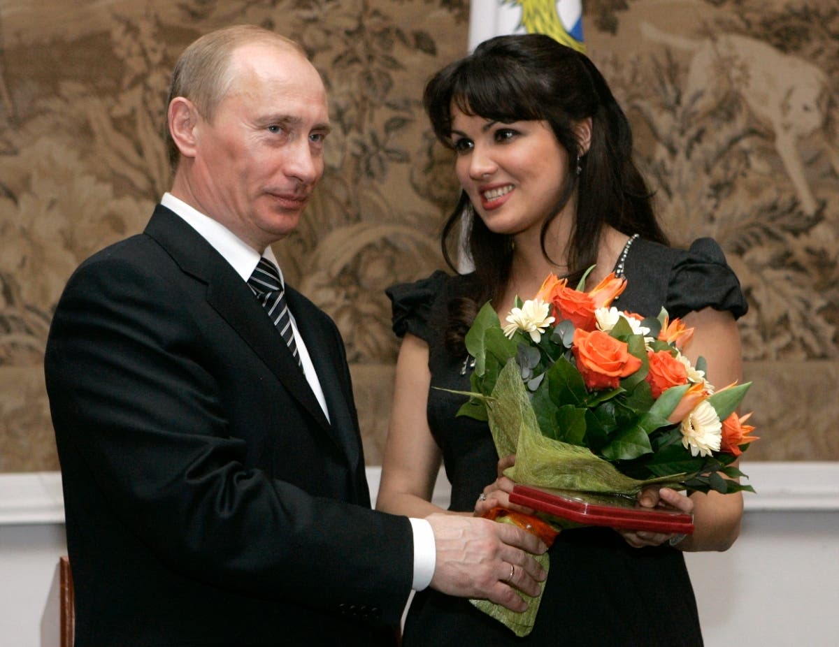 Russian President Vladimir Putin congratulates Russian opera singer Anna Netrebko after awarding her with the People's Artist of Russia honor, during the 225th anniversary celebrations of the Mariinsky Theater in St. Petersburg, Russia in 2008. 