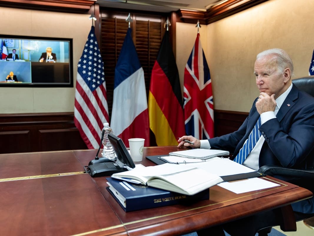 President Joe Biden listens during a secure video call with French President Emmanuel Macron, German Chancellor Olaf Scholz and British Prime Minister Boris Johnson in the Situation Room at the White House on Monday.