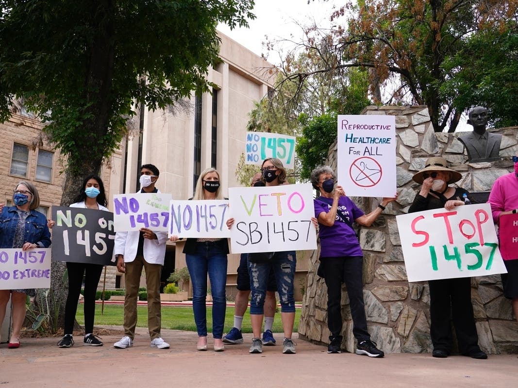 A number of Arizona reproductive health, rights, and justice advocates protest an abortion bill at the Arizona Capitol April 26, 2021, in Phoenix. 