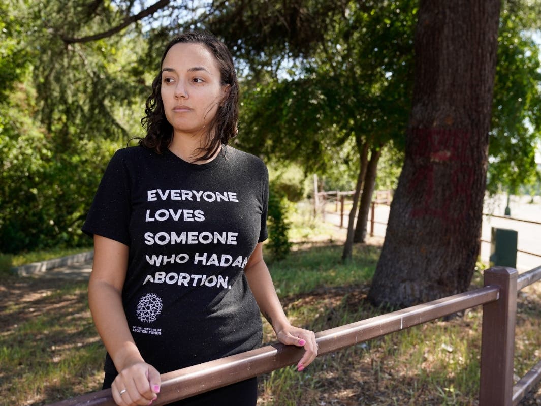 Jessica Pinckney poses at a park near her office in Oakland, Calif., Wednesday, May 4, 2022. California has one statewide abortion fund, known as Access Reproductive Justice. The group helps roughly 500 women each year, about a third whom come from other 
