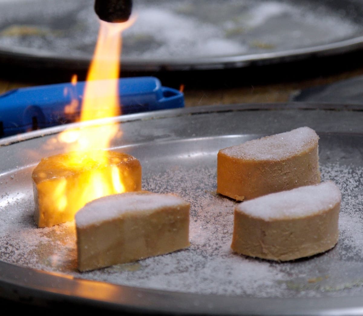 Foie gras is torched and made into a brulee at Sent Sovi in Saratoga, Calif., on May 11, 2012. A federal appeals court has upheld a ruling that limits California's 2012 foie gras ban.