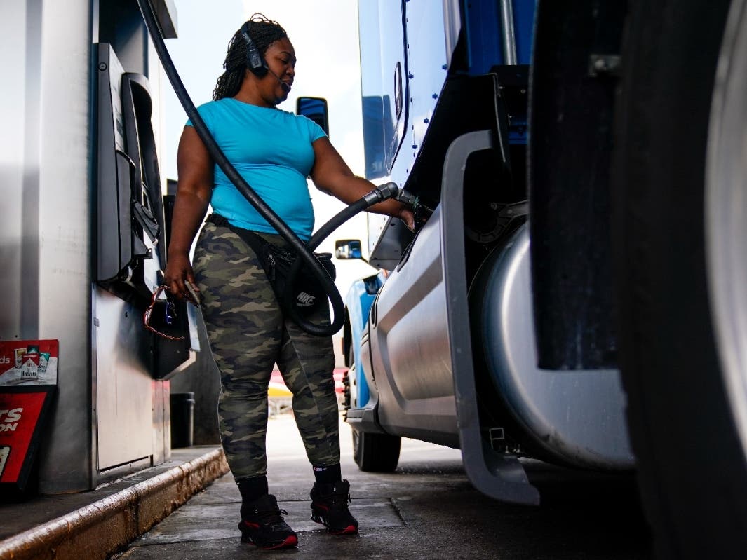 ​Houston trucker Delores Bledsoe fuels her rig at a truck stop in Carlisle, Pennsylvania, on Wednesday, the same  day the Labor Department reported that surging prices for gas, food and rent catapulted consumer inflation to a new four-decade peak in June.