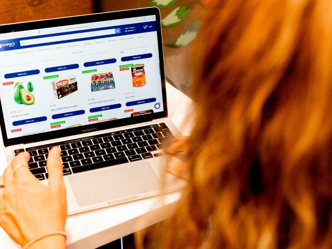 Caroline Hansen uses Emma's Premium Services, a higher-priced service according to Hansen, to shop for food for her husband, Thursday, Aug. 11, 2022, in New York. 