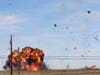 In this photo provided by Nathaniel Ross Photography, a historic military plane crashes after colliding with another plane during an airshow at Dallas Executive Airport in Dallas on Saturday, Nov. 12, 2022.