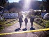 FBI officials walk towards the crime scene at Mountain Mushroom Farm, Tuesday, Jan. 24, 2023, after a gunman killed several people at two agricultural businesses in Half Moon Bay.
