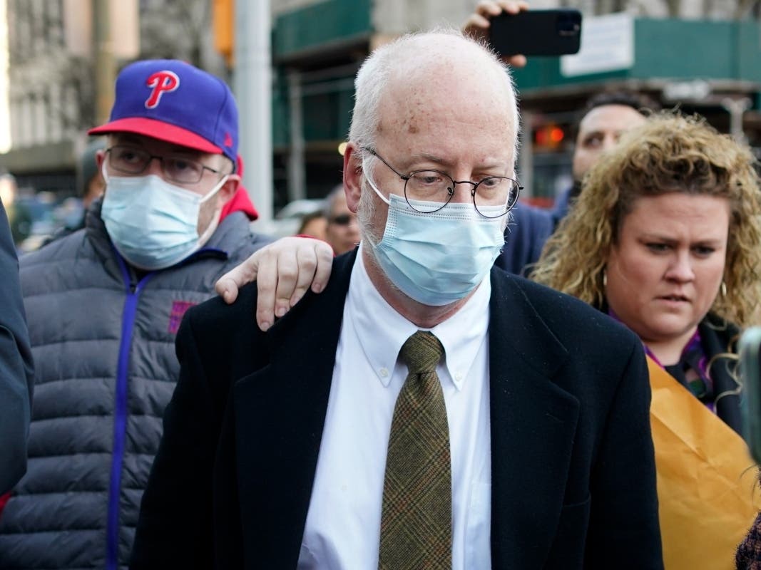 Robert Hadden, center, leaves the federal courthouse in New York, Tuesday, Jan. 24, 2023. 