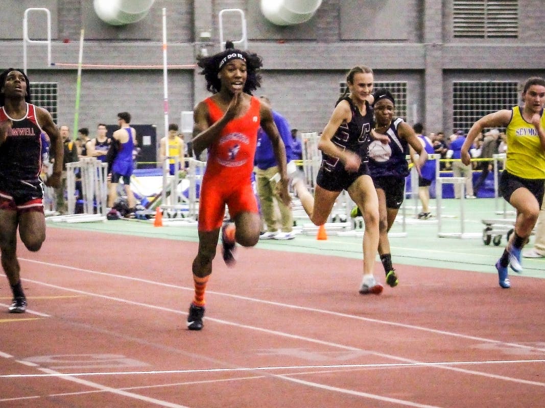 Bloomfield High School transgender athlete Terry Miller, second from left, wins the final of the 55-meter dash over transgender athlete Andraya Yearwood, far left, and other runners in the CT girls Class S indoor track meet at Hillhouse High School.