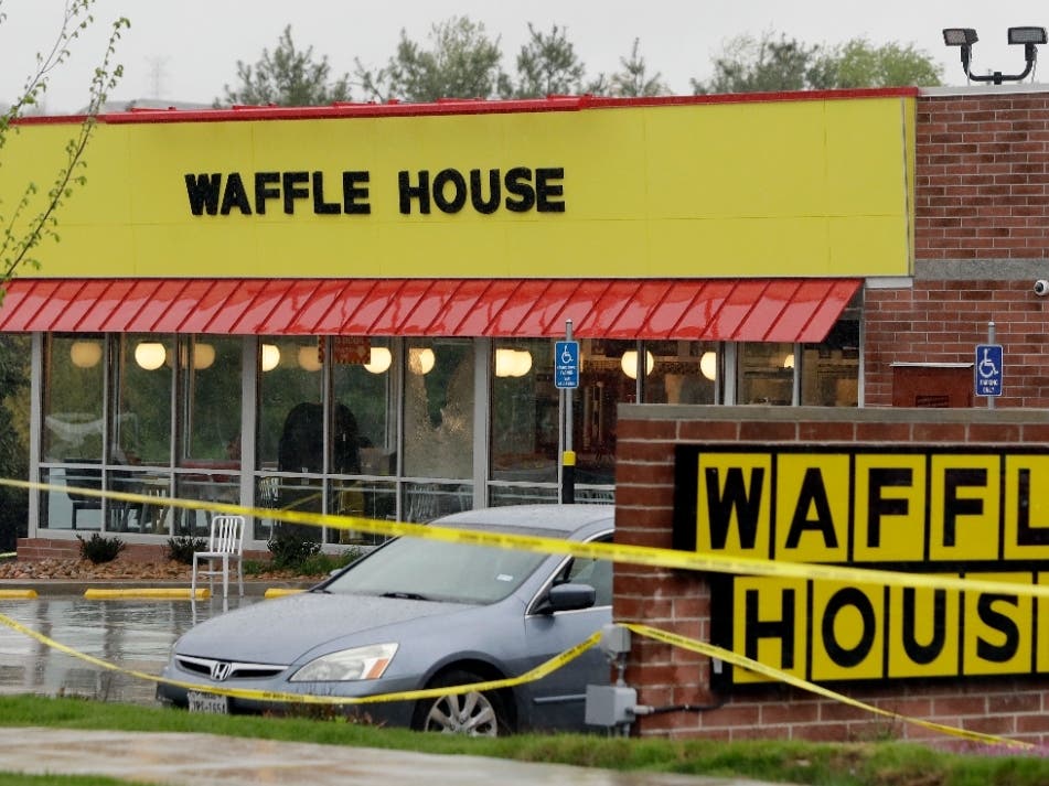  An Illinois man was sentenced Friday to 18 months in prison after being convicted of illegally giving his son an assault-style rifle he later used to shoot and kill four people at a Waffle House in Tennessee.