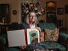 Judy Wade, niece of Luther Story, is seen with a memory scrapbook of Luther Story that her mother put together, Thursday, May 18, 2023, in Americus, Georgia.