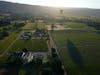 A hot air balloon floats over vineyards, seen from a Napa Valley Aloft balloon, in Napa, Calif., Monday, June 19, 2023. 