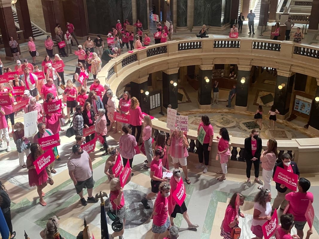 Abortion rights supporters gather for a "pink out" protest organized by Planned Parenthood in the rotunda of the Wisconsin Capitol in 2022. Dane County Judge Diane Schlipper refused to toss out a lawsuit challenging Wisconsin's 174-year-old abortion ban.