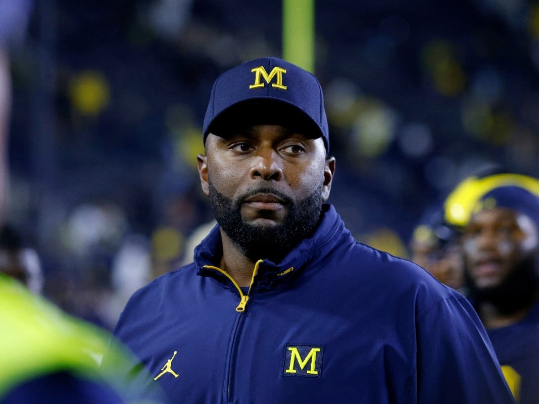 Michigan coach Sherrone Moore walks off the field following an NCAA football game Aug. 30, 2025, in Ann Arbor, Mich.