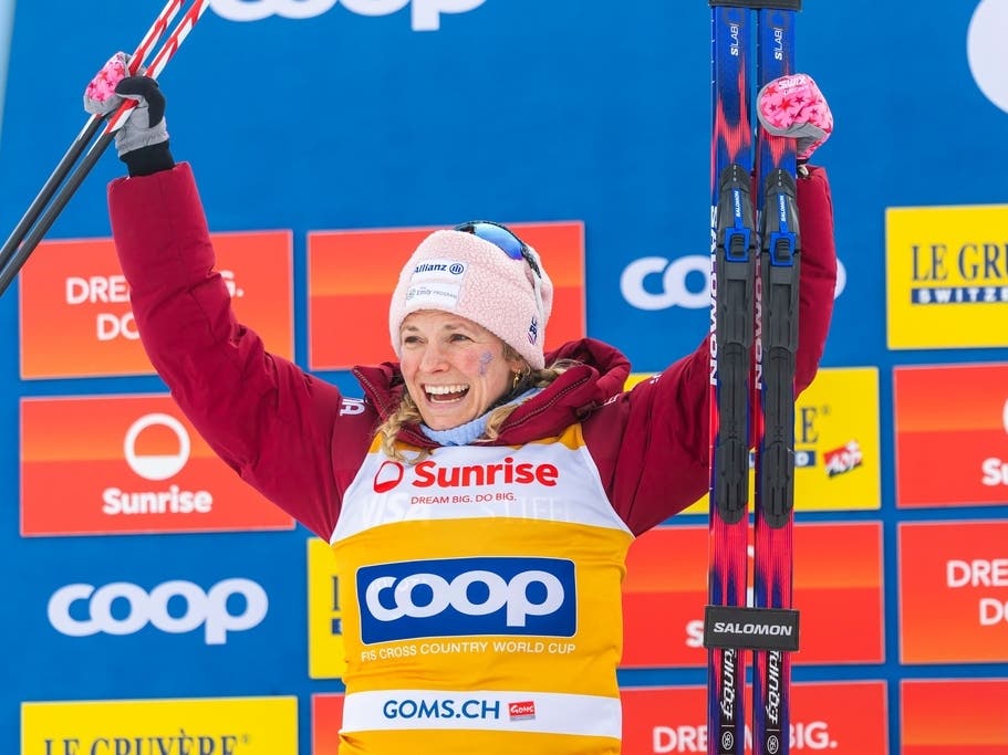 Jessie Diggins of United States celebrates her second-place finish on the podium after the women's 20km mass start classic skiing race, at the FIS Cross-Country World Cup at the Nordic Center Goms, in Geschinen, Switzerland, on Jan. 25, 2026.