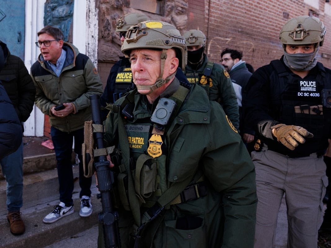 Border Patrol Cmdr. Gregory Bovino walks alongside his agents in the Little Village neighborhood of Chicago, Dec. 16, 2025.