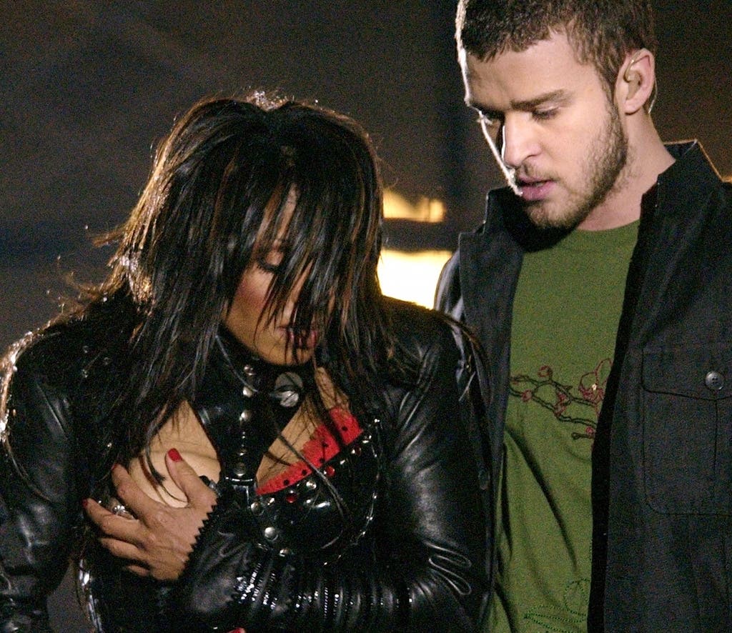Janet Jackson, left, covers her breast after a wardrobe malfunction during the halftime performance with Justin Timberlake at Super Bowl XXXVIII in Houston on Feb. 1, 2004. 