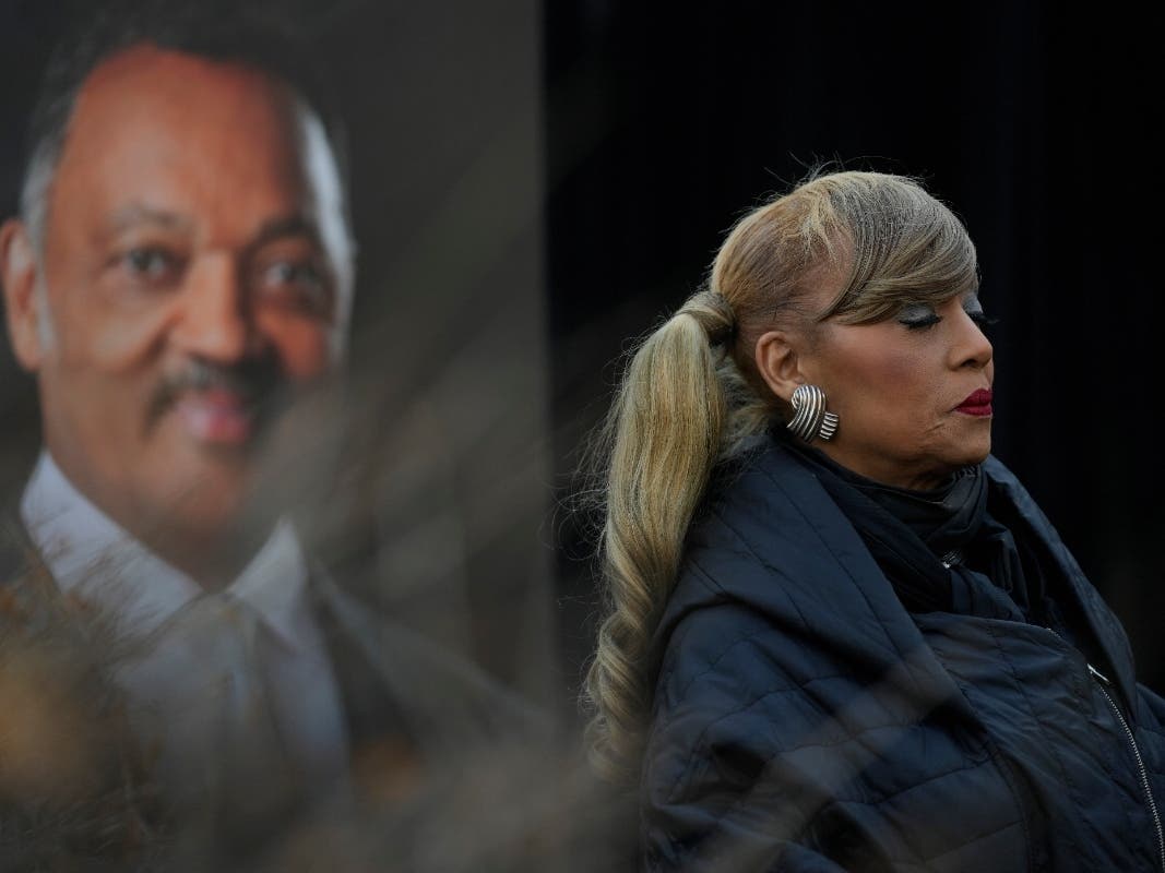 Santita Jackson stands near a picture of her father, the Rev. Jesse Jackson, during a news conference outside the family home Wednesday, Feb. 18, 2026, in Chicago.