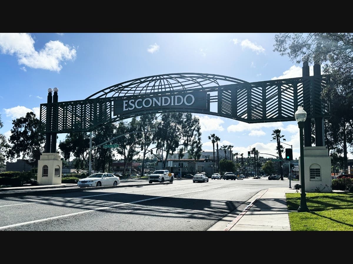 Motorists drive under a city sign on Wednesday, Feb. 18, 2026 in Escondido, Calif.