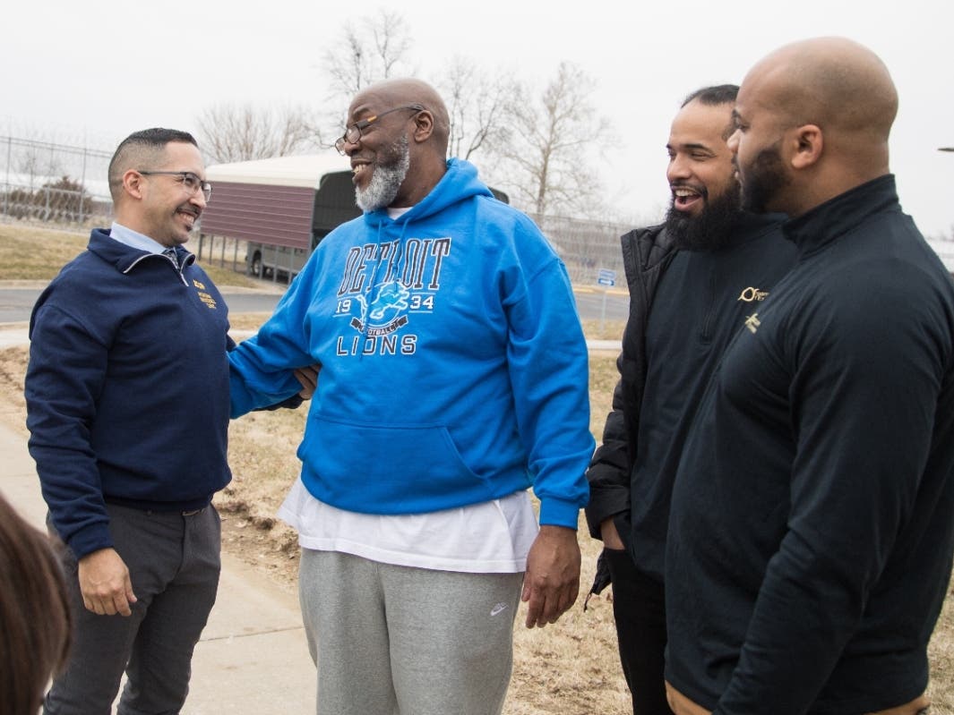 George Calicut Jr., second right, meets his legal team at a prison in Coldwater, Mich., on March 3, 2026, after a judge threw out his 1999 murder conviction and life prison sentence. 