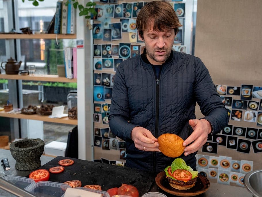 Noma's chef René Redzepi prepares a vegetarian burger in a restaurant, in Copenhagen, Nov. 24, 2024. 