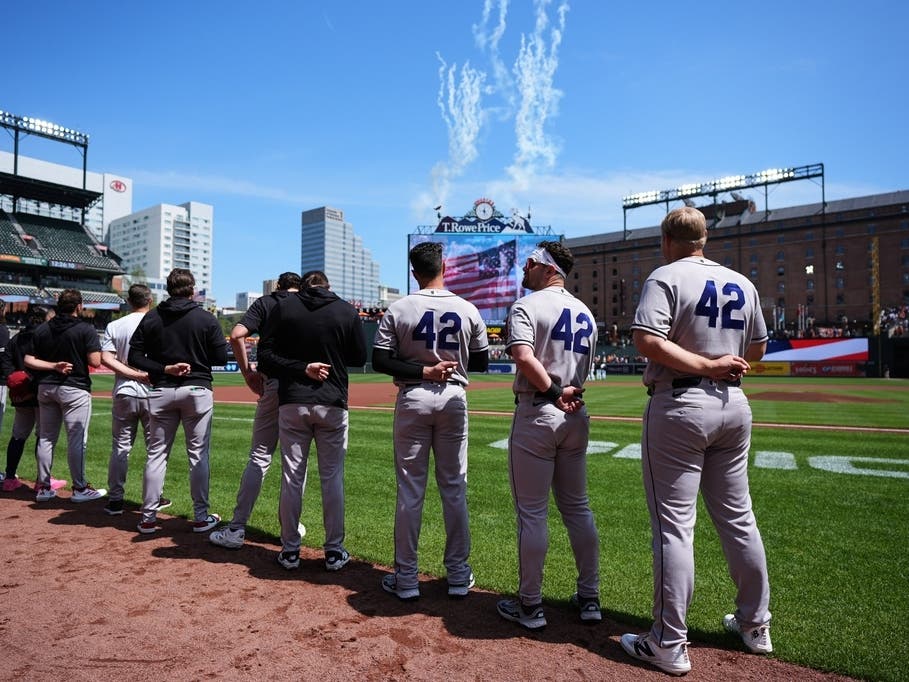 Arizona Diamondbacks players wear No. 42 to commemorate Jackie Robinson Day, as they observe the national anthem before a baseball game against the Baltimore Orioles, Wednesday, April 15, 2026, in Baltimore. 