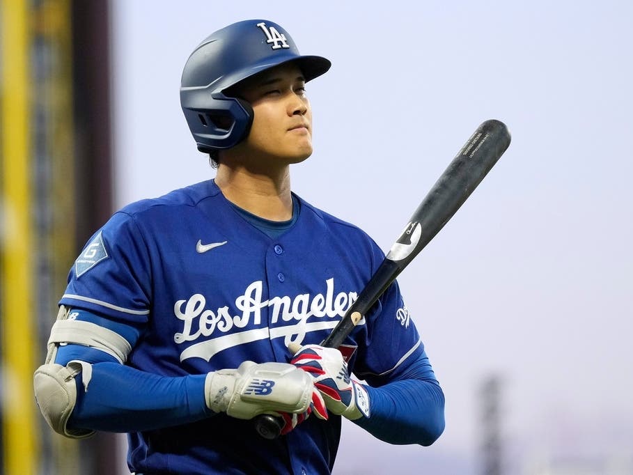 Los Angeles Dodgers' Shohei Ohtani walks to the dugout after striking out during the fifth inning of a baseball game against the San Francisco Giants, Wednesday, April 22, 2026, in San Francisco. 
