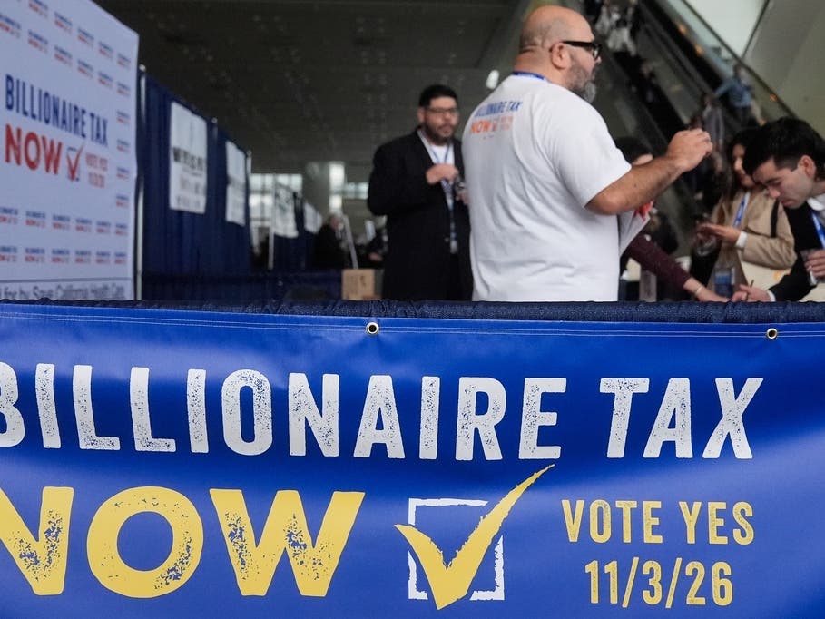  People visit the Billionaire Tax Now booth at the 2026 California Democratic Party State Convention in San Francisco, Feb. 21, 2026. 