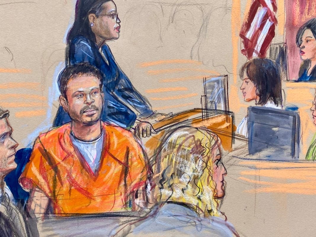 This courtroom sketch depicts Cole Tomas Allen, seated center, the California man arrested in the shooting incident at the correspondents dinner in Washington, seen appearing before U.S. Magistrate Moxila Upadhyaya, in federal court, Thursday, April 30.