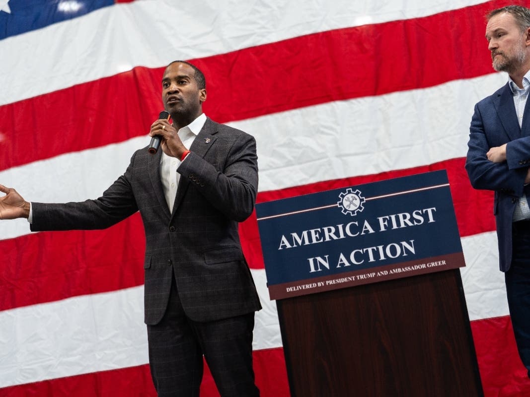 U.S. Trade Representative Jamieson Greer, right, listens to Rep. John James, R-Mich., left, speak during a tour of Atomic Industries' manufacturing facility, Thursday, April 9, 2026, in Warren, Mich. 