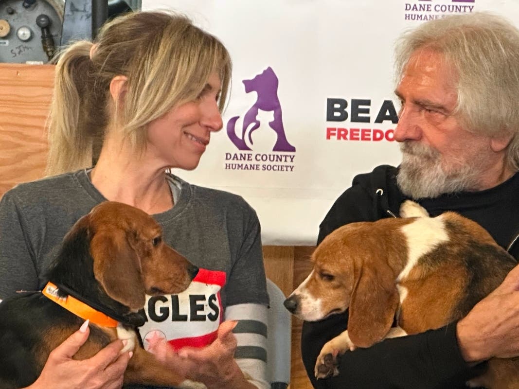 Pop star Debbie Gibson and Black Sabbath co-founder Terry "Geezer" Butler hold beagles that were purchased from a Dane County animal research facility on Tuesday, May 12, 2026, in Madison, WI.