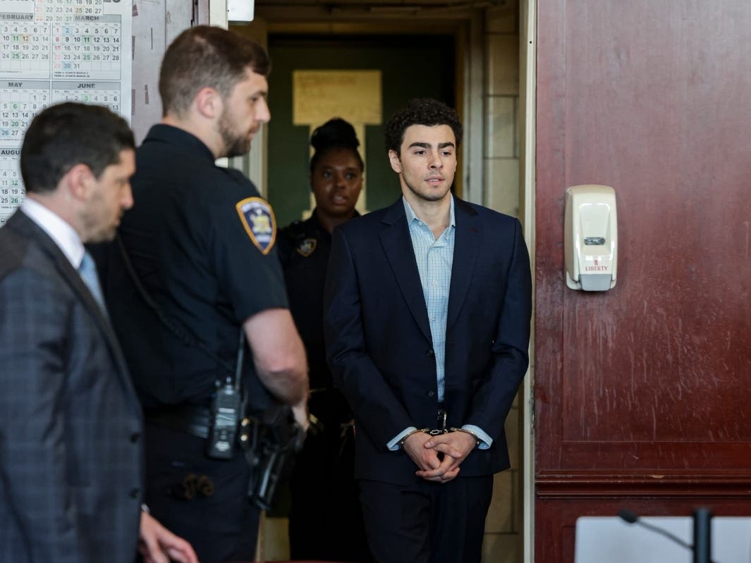 Luigi Mangione arrives for a hearing in Manhattan Criminal Court in New York, Monday, May 18, 2026.
