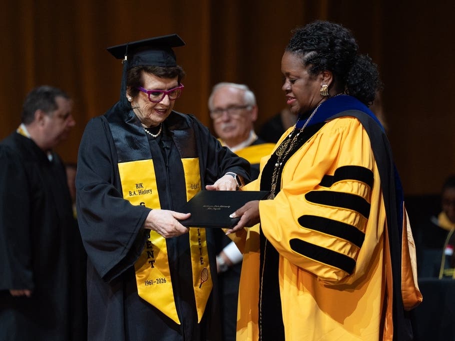 Tennis legend Billie Jean King, left, receives her diploma from California State University, Los Angeles, President Berenecea Johnson Eanes during commencement in Los Angeles, Monday, May 18, 2026. 