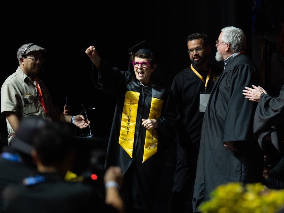 Tennis legend Billie Jean King raises her fist after being called to receive her diploma during California State University, Los Angeles, commencement in Los Angeles, Monday, May 18, 2026.