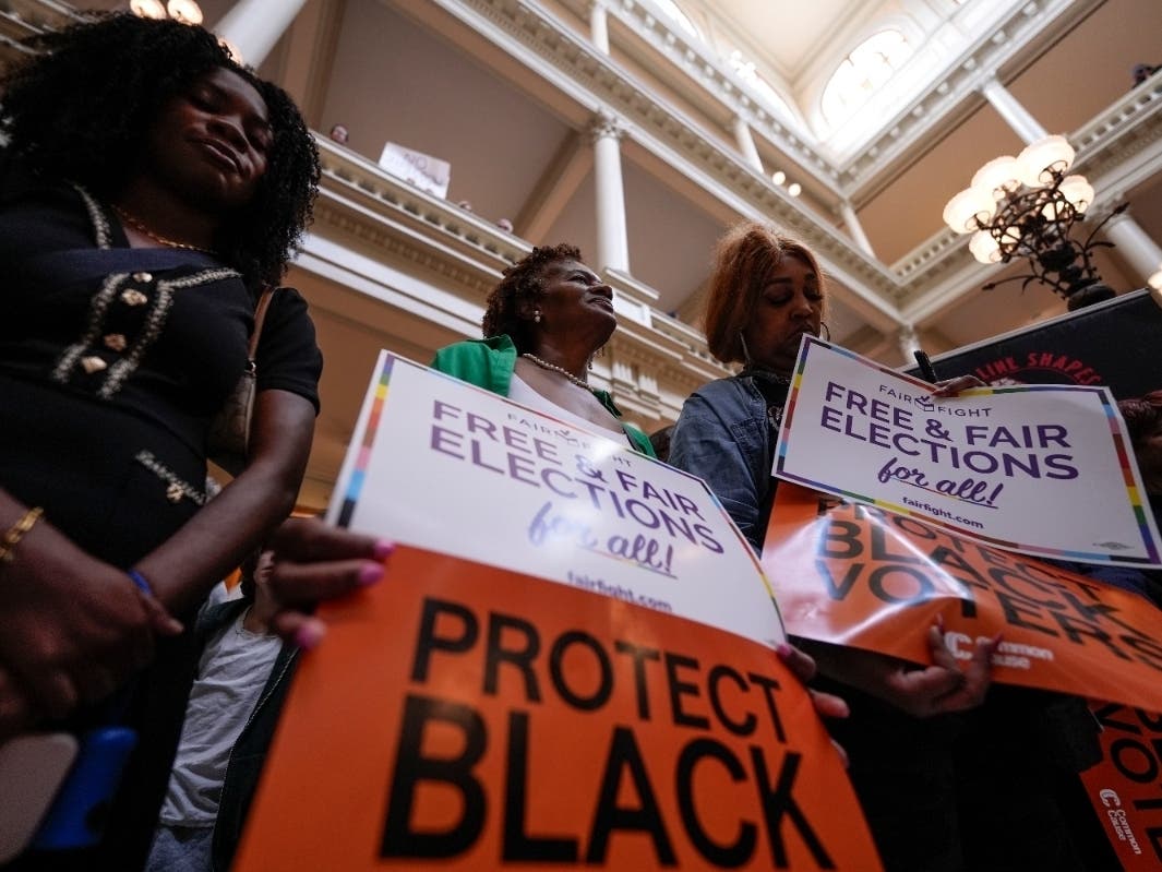 People demonstrate during a special legislative session at the state capitol, Wednesday, June 17, 2026, in Atlanta.