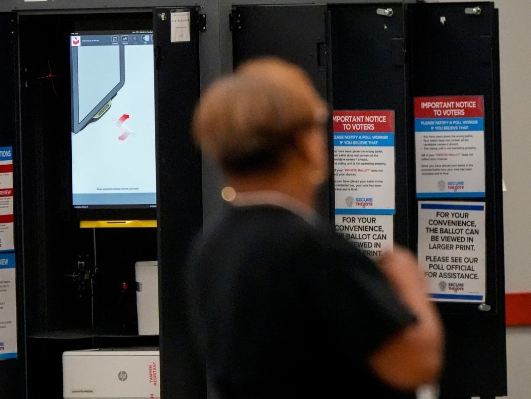 A voting machine is seen as people vote in a runoff election at the C.T. Martin Recreation Center, Tuesday, June 16, 2026, in Atlanta.