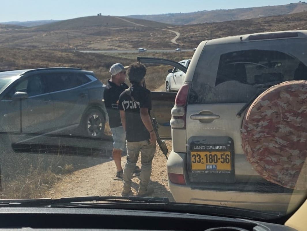 In this photo provided by Cameron Kasky, armed men block the road, stopping vehicles containing U.S. Rep. Ro Khanna, D-Calif., and his delegation near the West Bank village of Khirbet Zanuta, Wednesday, July 8, 2026.