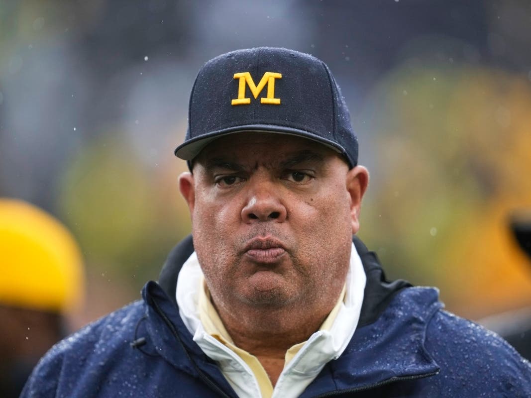 University of Michigan Athletic Director Warde Manuel will step down at the end of 2026 after a decade-long run and multiple scandals.