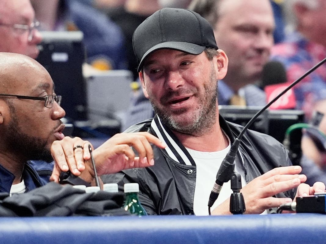 Former NFL quarterback Tony Romo, right, attends an NBA basketball game between the Indiana Pacers and the Dallas Mavericks on March 5, 2024, in Dallas.