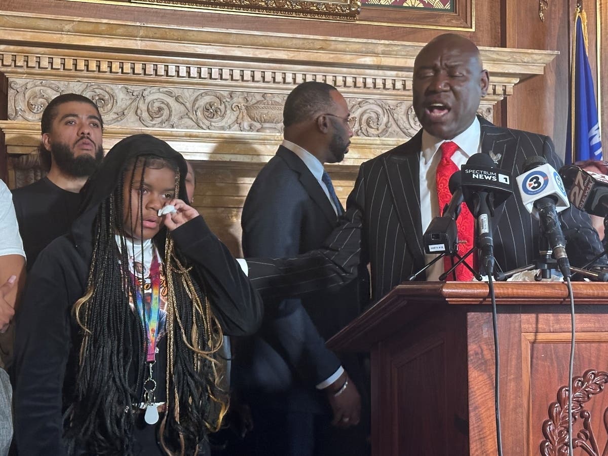 Kah'liyah Aliomar, the daughter of Corey Ruiz, who was shot and killed by a Madison police officer, wipes away tears as attorney Ben Crump speaks at a news conference on Friday, July 24, 2026, in Madison, Wis.