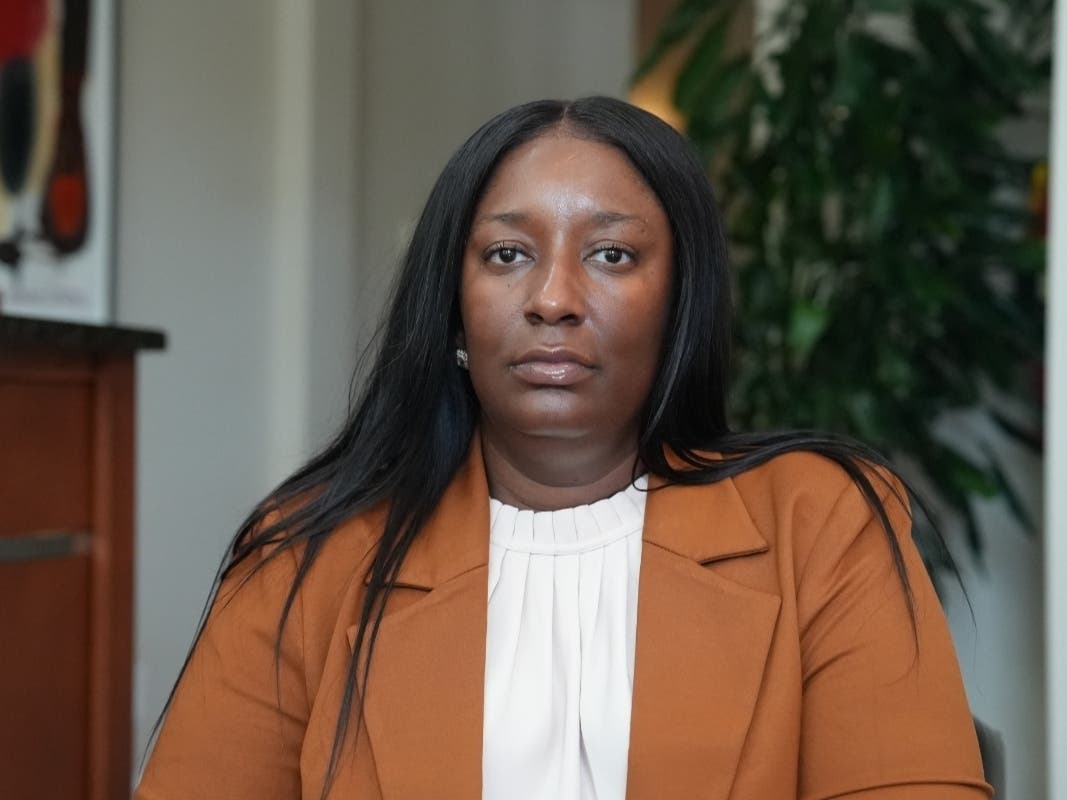 Cassandra Barksdale, who says she was wrongly diagnosed with cancer due to a tissue labelling mistake, poses at her attorney's office in Atlanta, Ga., Thursday, Aug. 6, 2026