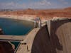 People walk across the Glen Canyon Dam near Lake Powell at the Glen Canyon National Recreation Area, Tuesday, July 14, 2026, near Page, Nev. 