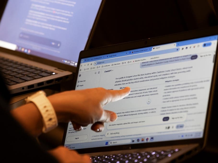Teachers work with AI on their laptops during a Charleston County School District symposium for educators on July 22 in North Charleston, South Carolina.