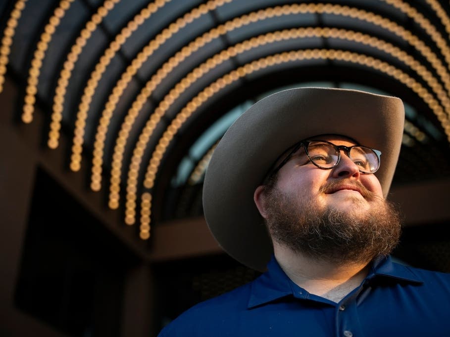Giles Sims, who is getting a 90-hour bachelor of applied science in communication from Ensign College poses for a portrait on campus in Salt Lake City, Utah.