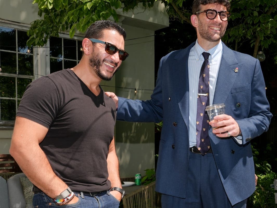 Abdul El-Sayed, a progressive candidate in the Democratic primary for U.S. Senate in Michigan, talks poolside with streamer Hasan Piker at a party for content creators supporting his campaign on Aug. 3.